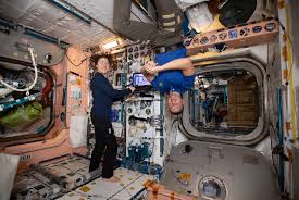 Image of International Space Station interior and astronauts